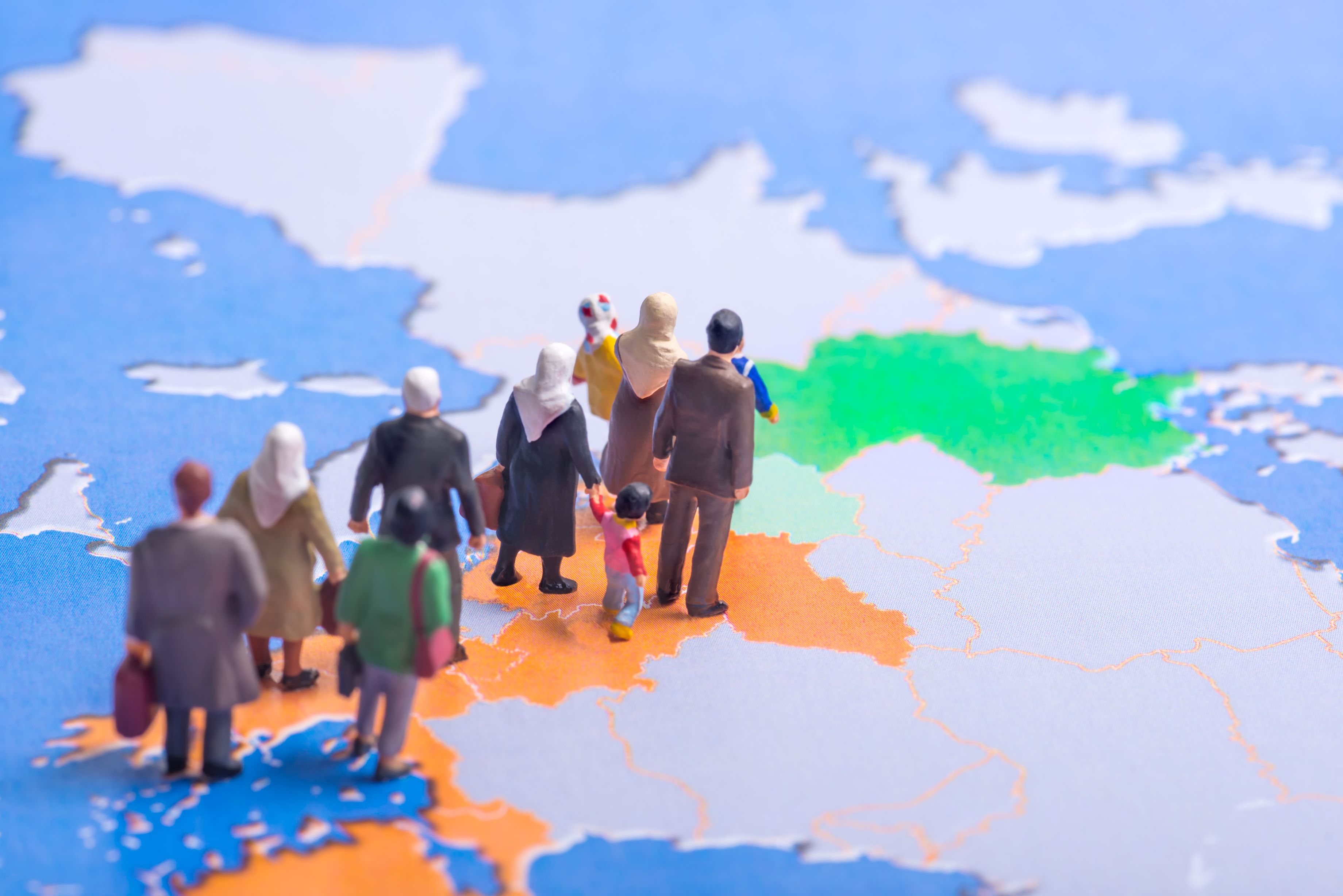 figurines of migrats making their way across Europe