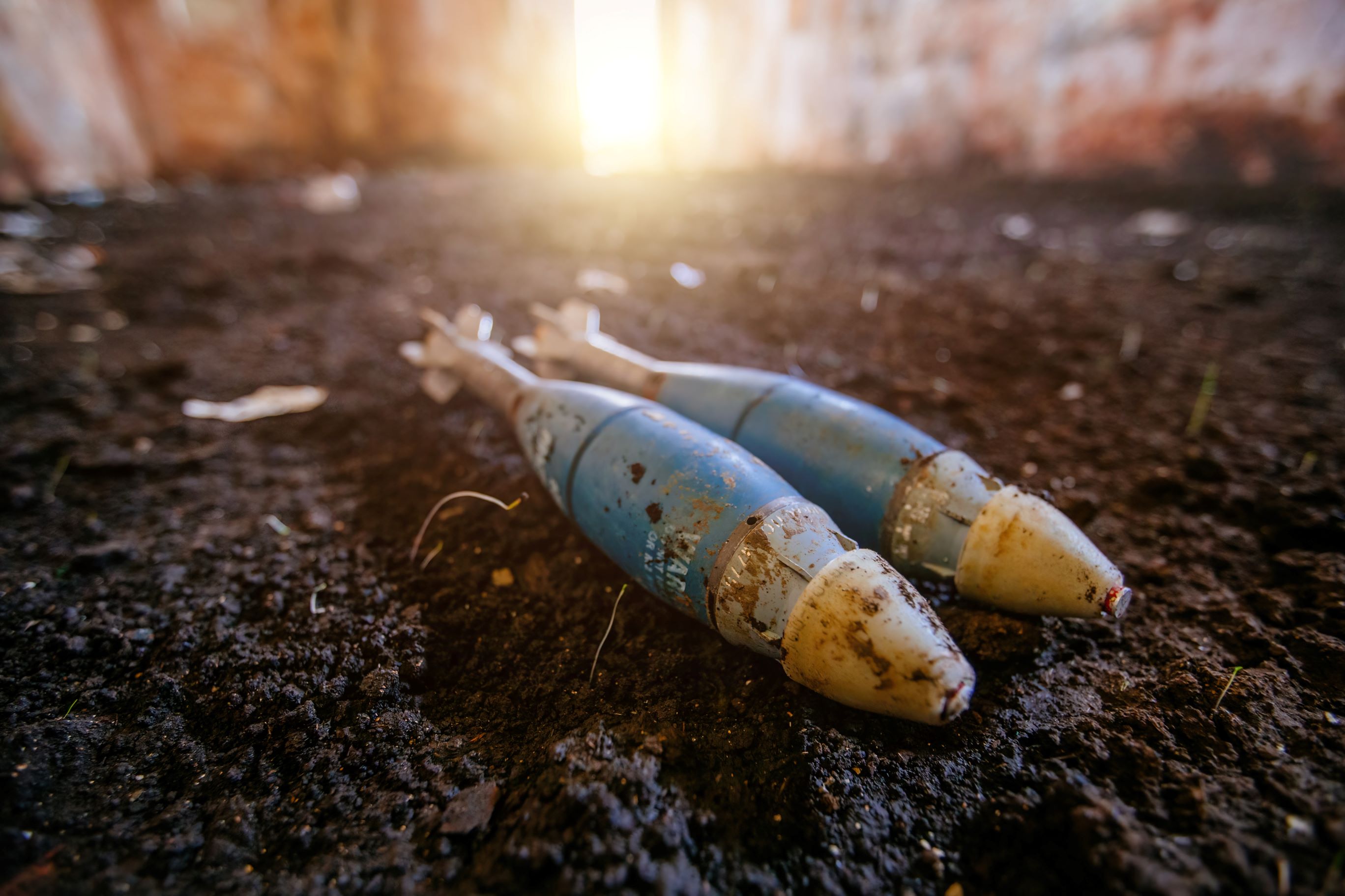 two unexploded ordnance devices on the ground