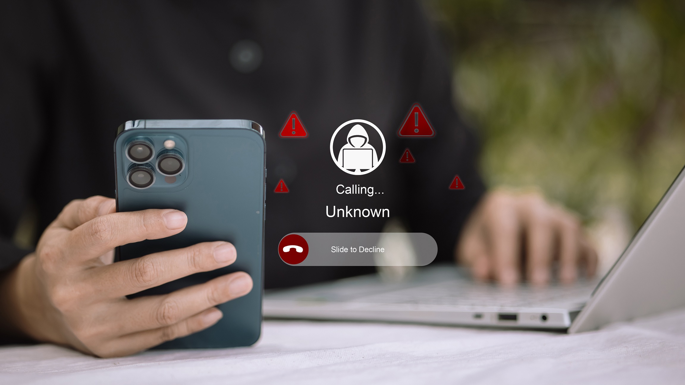 Hand holding a smartphone with illustrations showing incoming calls from unknown user, with exclamations marks to denote risk